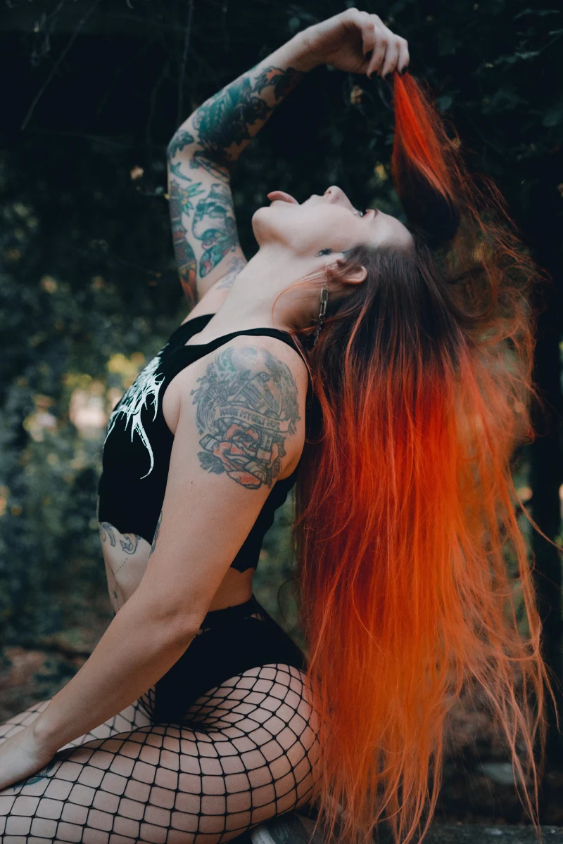 portrait of a woman with very long orange hair